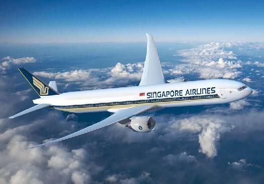 Singapore Airlines Airbus flying in blue sky with clouds