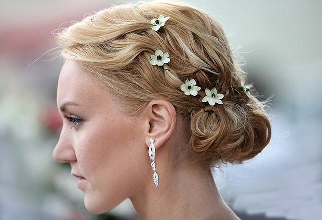 girl with golden brown hairs and flower pins side pose